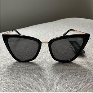 Quay   Australia sunglasses Gold metal arms. Modern cat-eye. Smoke lens